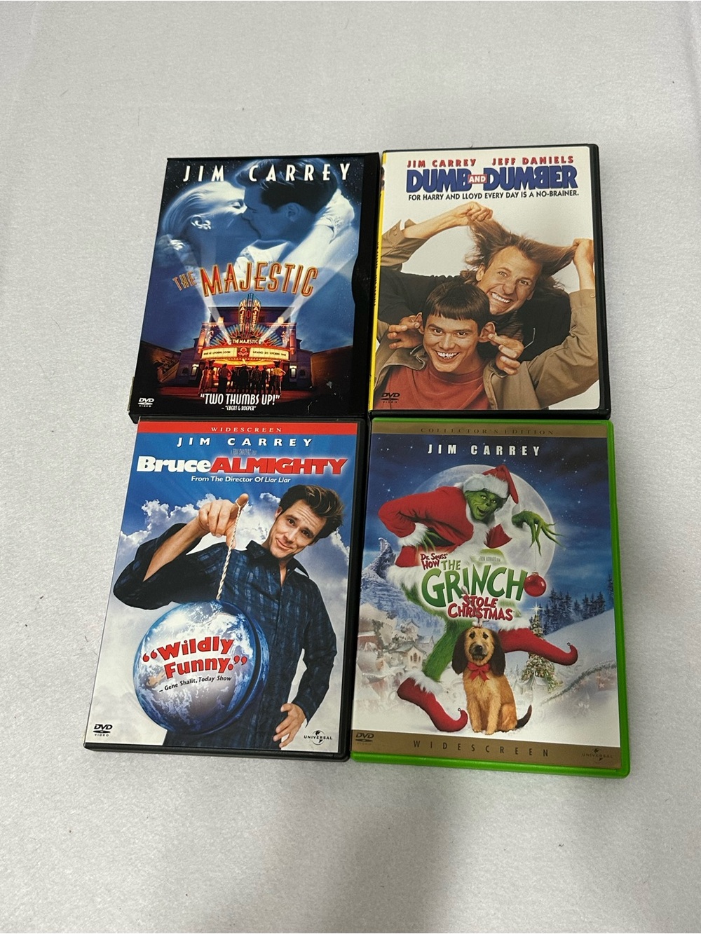 Jim Carrey 4 DVD Movie Lot The Grinch Bruce Almighty Dumb and Dumber Majestic